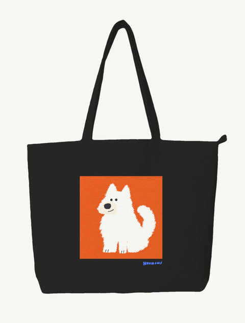 Black large canvas tote bag with a flat colour white Indian Spitz sitting on a terracotta block and a royal blue Hoomans wordmark, front view