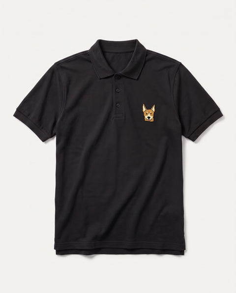 Black polo shirt with embroidered Indian indie dog face on the chest, front flat lay