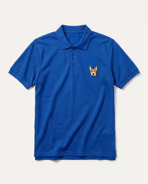 Royal blue polo shirt with embroidered Indian indie dog face on the chest, front flat lay