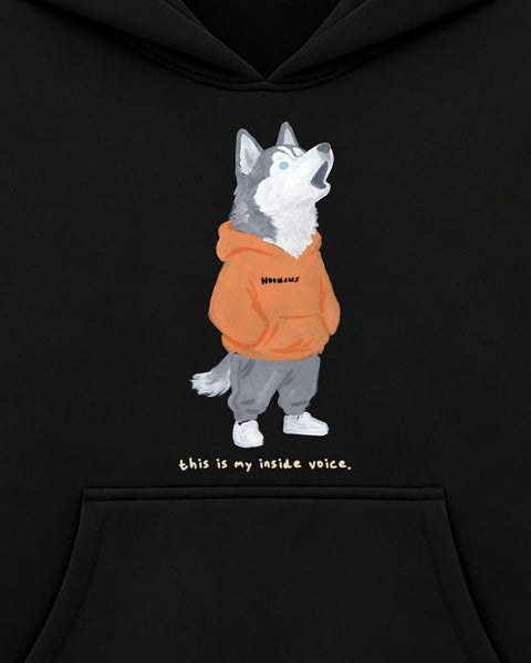 Close up of the chest print: a howling husky in an orange HOOMANS hoodie above 'this is my inside voice.'