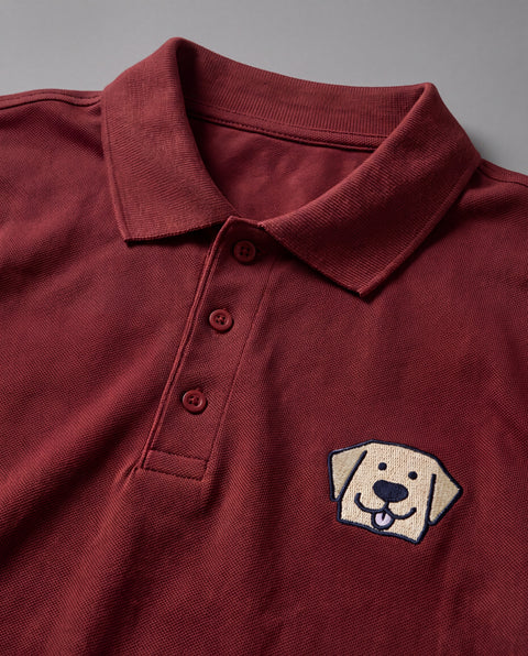 Brick red embroidered Labrador polo, close-up of collar, button placket, and satin-stitch chest patch