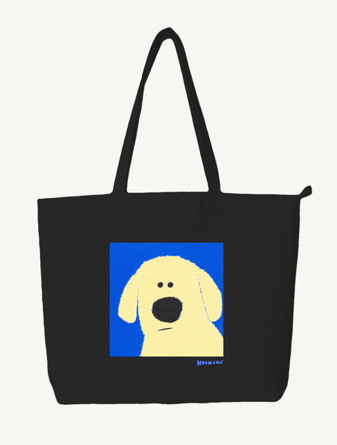 Black large canvas tote bag with a flat colour Labrador face on a cobalt blue block and a blue Hoomans wordmark, front view