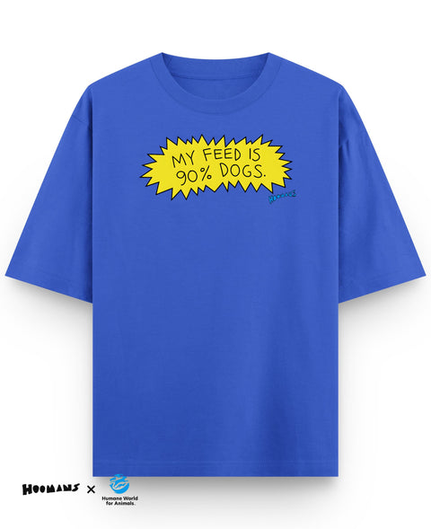 Royal blue oversized tee with My feed is 90% dogs. hand lettered in a yellow comic burst, front view, Hoomans x Humane World for Animals India lockup