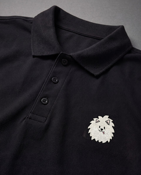 Black embroidered Pomeranian polo, close-up of collar, button placket, and satin-stitch chest patch