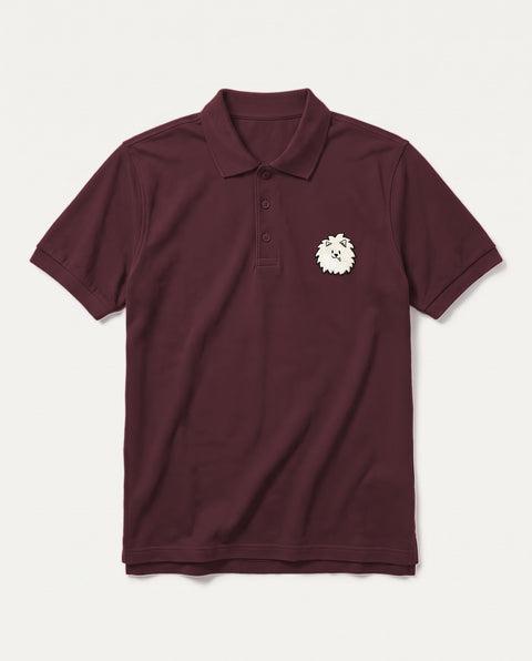 Maroon polo shirt with embroidered Pomeranian face on the chest, front flat lay