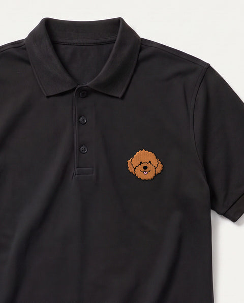 Black embroidered Poodle polo, close-up of collar, button placket, and satin-stitch chest patch