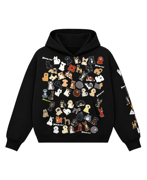 Black boxy hoodie with 75 painted dog breeds tossed at every angle over the front and down the left sleeve, front view