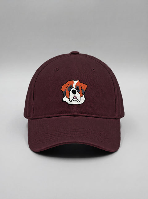 Maroon baseball cap with embroidered saint bernard face, front view