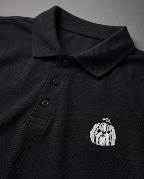 Black embroidered Shih Tzu polo, close-up of collar, button placket, and satin-stitch chest patch