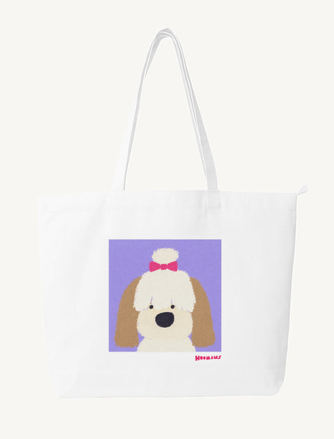 White large canvas tote bag with a flat colour Shih Tzu with a pink bow on a lavender block and a raspberry Hoomans wordmark, front view