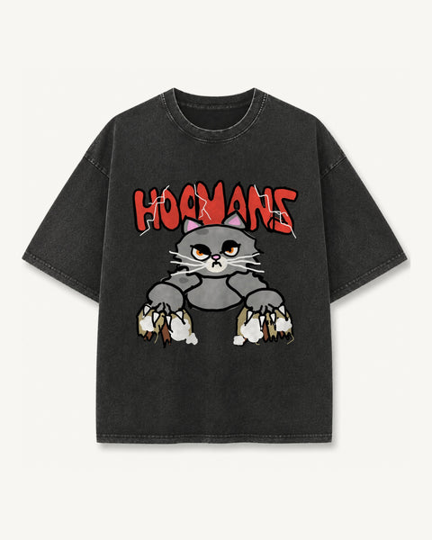 Black vintage wash oversized tee with a grumpy grey Persian cat clawing through sofa stuffing under a red hoomans logo, front flat lay