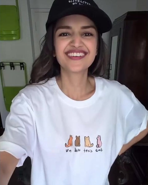 Tara Alisha Berry in a Hoomans cat tee and cap
