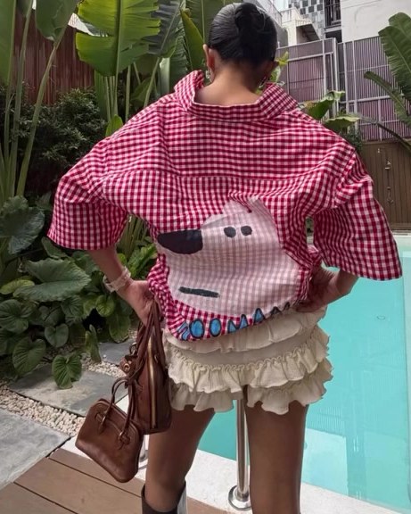 Mermaid Scales in a Hoomans dog shirt by a pool