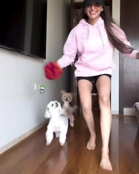 Jinita Sheth in the Hoomans Dog Mom hoodie with her dogs