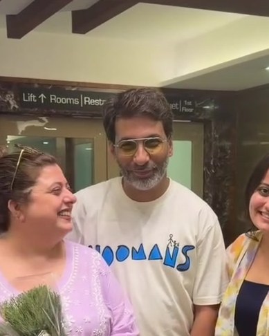 DJ Percy in the Hoomans logo tee with Delnaaz Irani