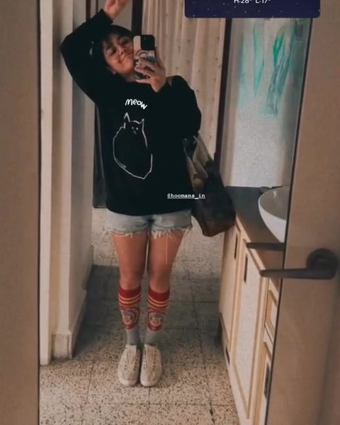 battatawada in a Hoomans meow sweatshirt