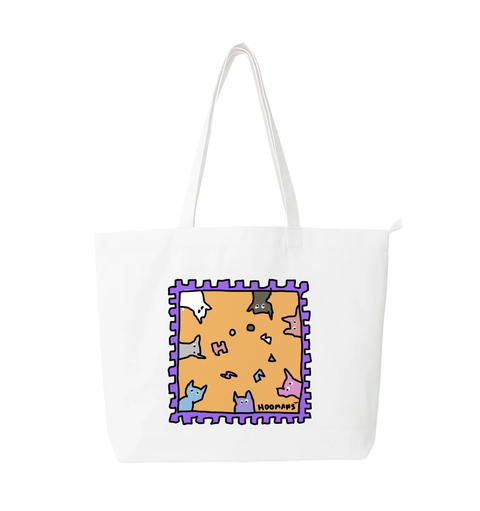Hoomans Stamp white cotton tote bag printed with an illustrated postage stamp of cats peeking in from every edge