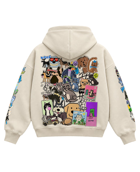 Back of the cream boxy hoodie covered in overlapping cat and dog stickers and HOOMANS wordmarks, flat lay