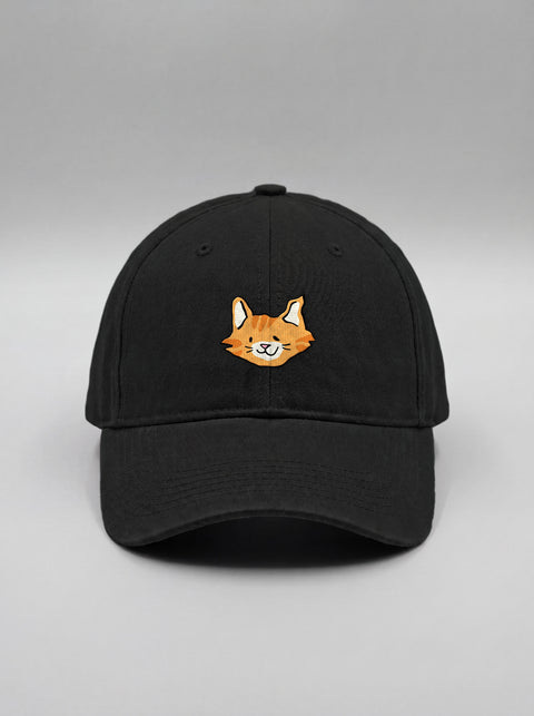 Black baseball cap with embroidered orange tabby cat face, front view