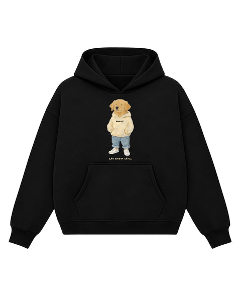 Black boxy hoodie with a painted golden retriever in a cream hoodie, light jeans and white sneakers above the line 'the golden child.', front flat lay