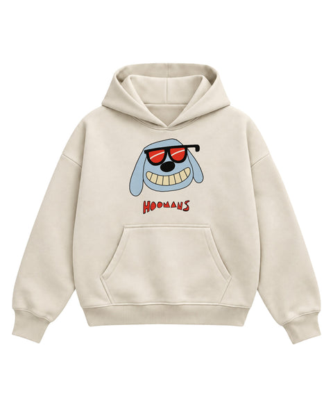 Cream boxy hoodie with a sky blue cartoon dog with long floppy ears, red sunglasses and a wide toothy grin above a red HOOMANS wordmark, front flat lay