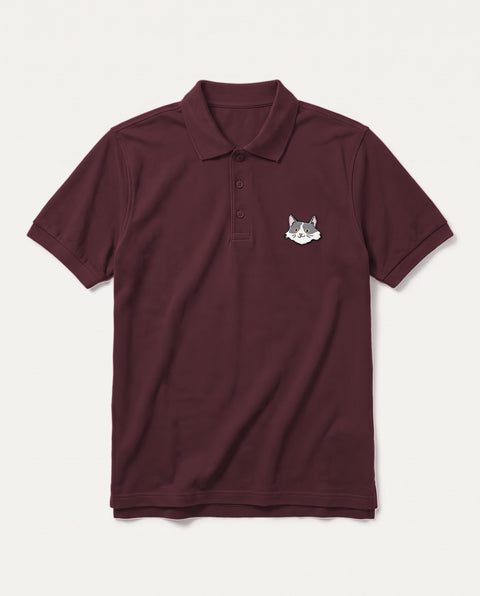 Maroon polo shirt with embroidered white and grey cat face on the chest, front flat lay