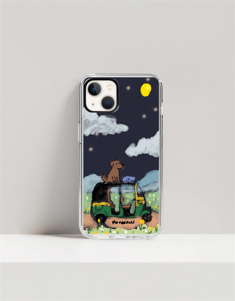 Hoomans Night Shift iPhone case — hand-painted dog and sleeping cat riding an auto-rickshaw roof under a yellow moon, on iPhone 13 mockup