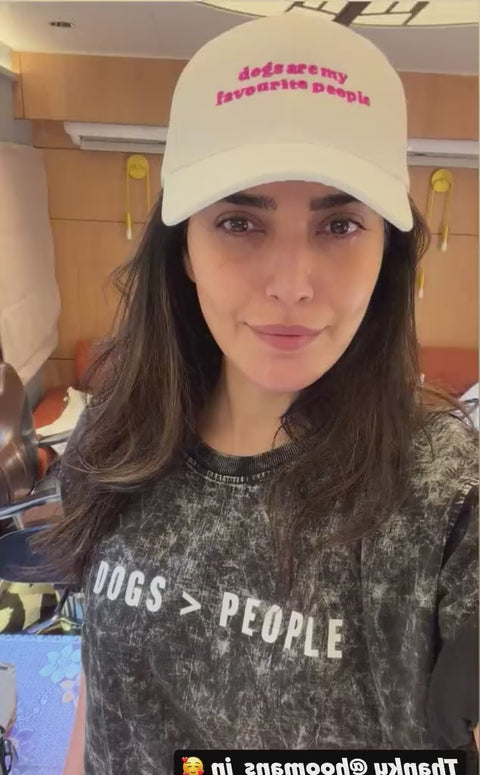 Karishma Tanna wearing the Dogs Are My Favourite People cap and acid wash tee, mirror selfie video, Hoomans India