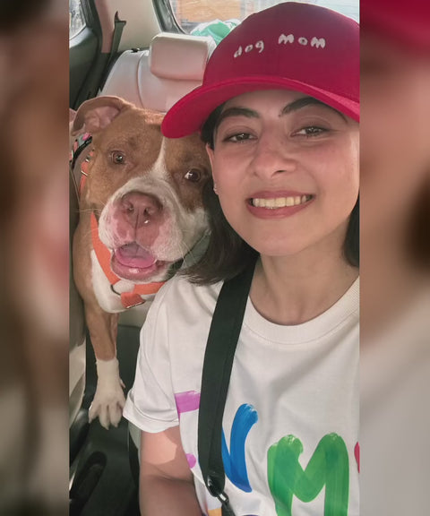 Real customer in the red Dog Mom cap taking a car selfie with her pitbull, Hoomans India
