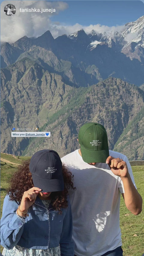 Real customers wearing Dog Walking Is My Cardio caps on a mountain trek, Hoomans India