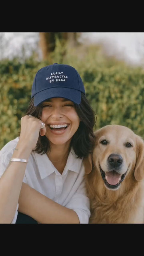 Dog Walking Is My Cardio cap in green and red worn with a golden retriever, real customer video, Hoomans India