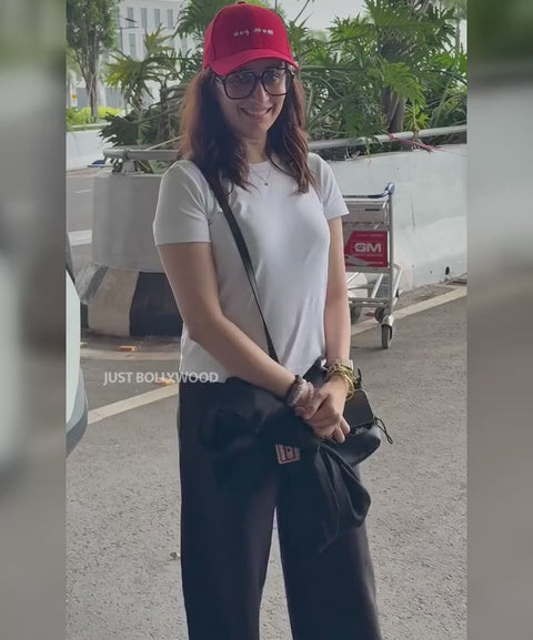 Shraddha Kapoor wearing the red Dog Mom cap at the airport, Hoomans India
