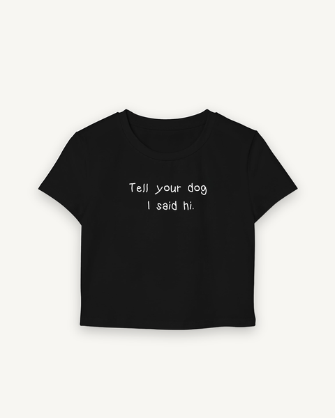 Tell Your Dog Baby Tee — flat product shot on off-white background
