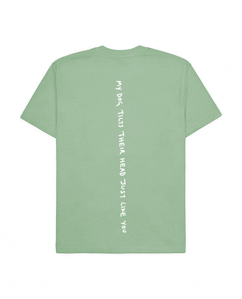 Jade oversized tee with 'My Dog Tilts Their Head Just Like You' white puff print, back flat lay